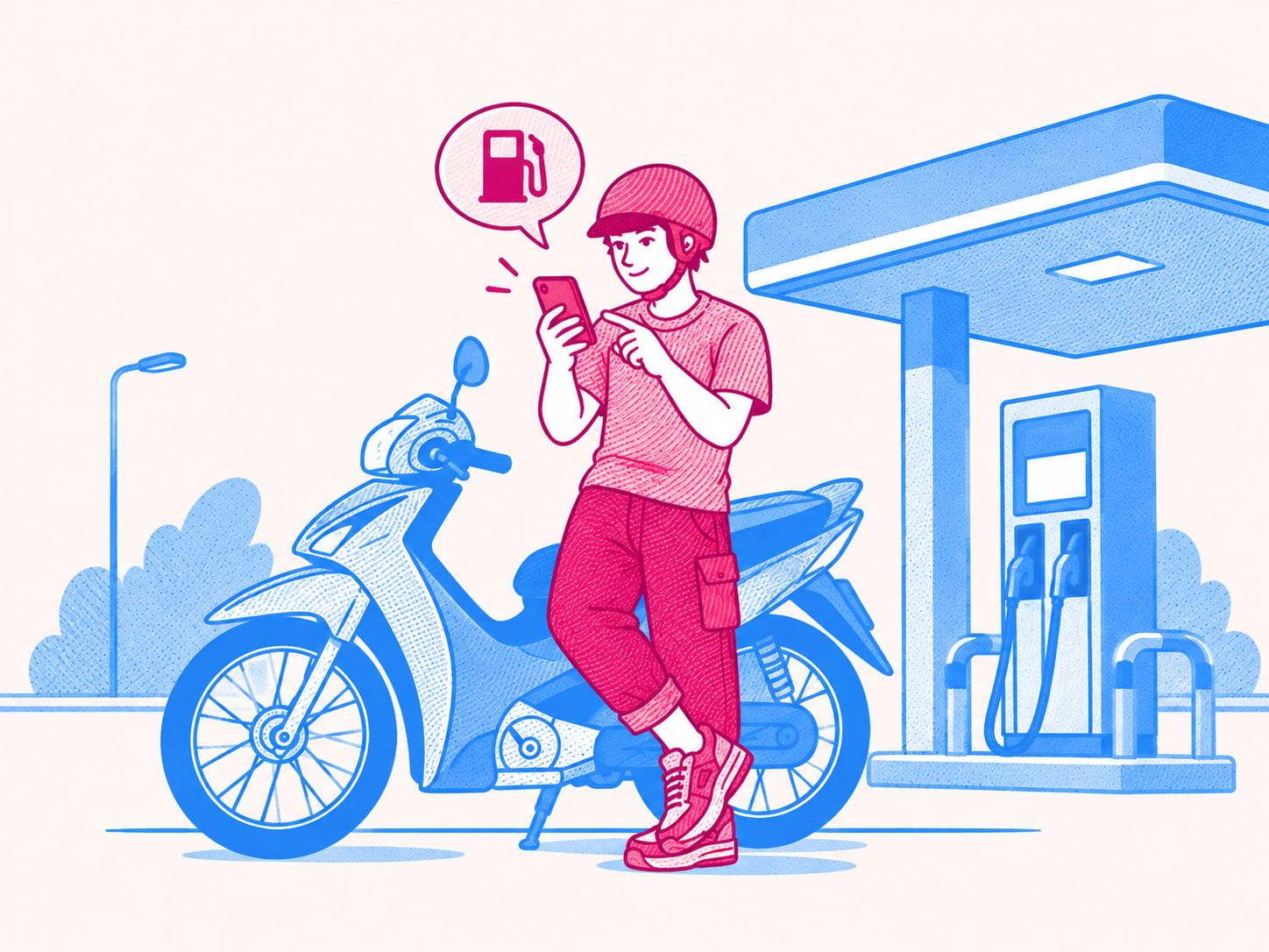 Người đi xe máy xem giá xăng trên điện thoại cạnh cây xăng